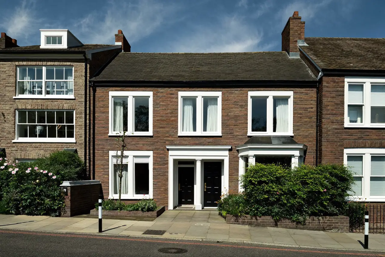 Victorian terraced house with newly installed white sash-style windows